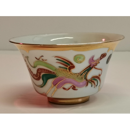 199 - Three Chinese dragon Ceramic teacups with four saucers (1 with Chip) finished with gilt gold, plus s... 