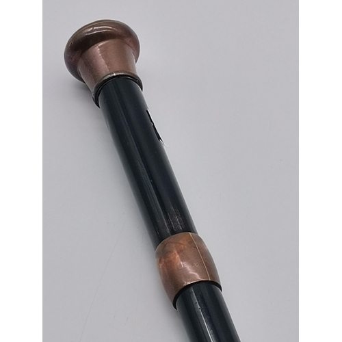 2 - A late 19th Century black japanned sword-stick walking cane with copper domed pommel, collar and tip... 