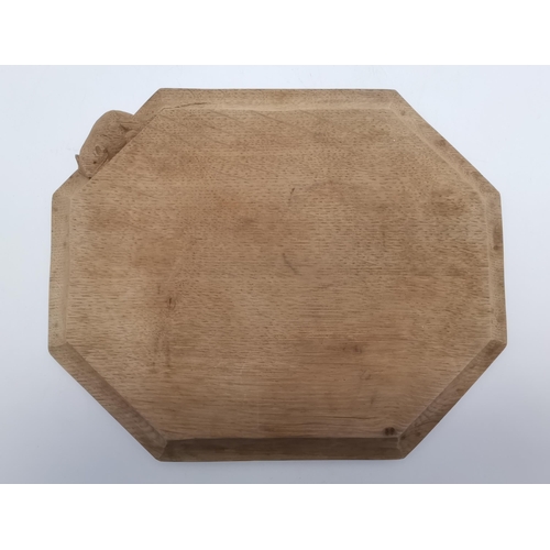 201 - Robert Thompson, a Mouseman oak bread board, elongated octagonal, lightly adzed surface and edge, wi... 