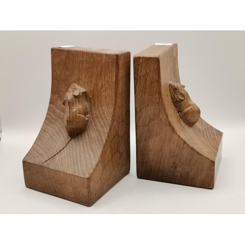 207 - Robert Thompson, a pair of Mouseman bookends, of typical form, lightly adzed all over, each with car... 