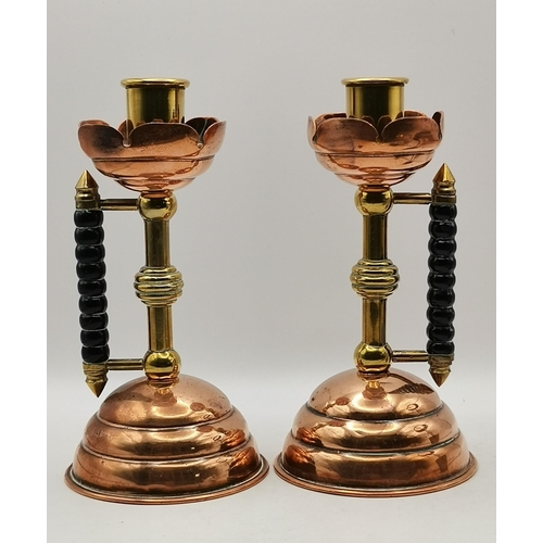 211 - A Pair of Antique Victorian Christopher Dresser style Candlesticks in copper and brass of typical Dr... 