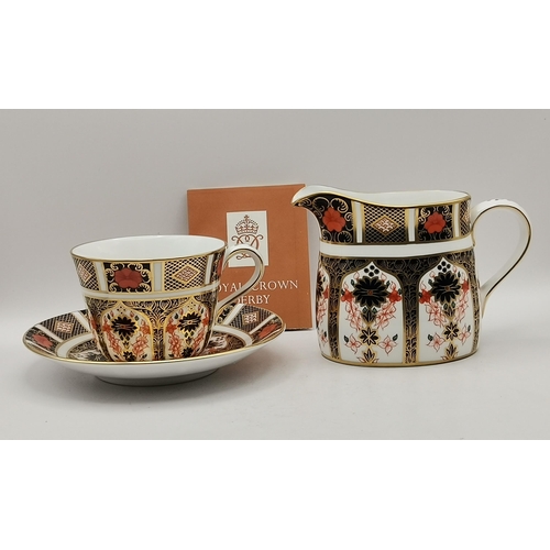 212 - Royal Crown Derby Old Imari pattern tea cup and saucer plus Crown Derby cream jug