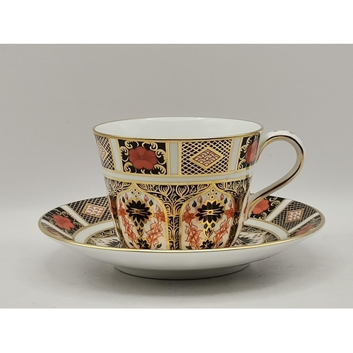 212 - Royal Crown Derby Old Imari pattern tea cup and saucer plus Crown Derby cream jug