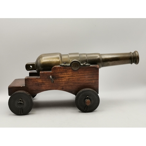 232 - Miniature Brass Cannon on wooden stand