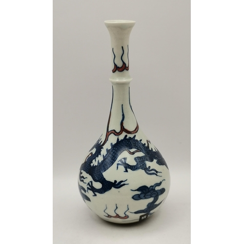 235 - A Kangxi Style Bottle Form Bud Vase C20th dragon decorated in cobalt with red highlights on white ba... 