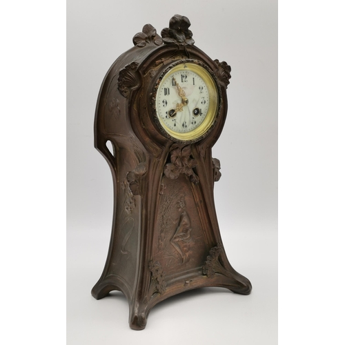 24 - An Art Nouveau three-piece clock garniture, 20th Century, copper patinated spelter, the cream circul... 