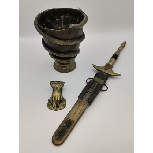 249 - A small group of metalware comprising a bronze and brass mortar; a Touareg telek dagger with sheath;... 