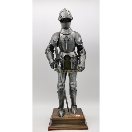 70 - A miniature model of a suit of armour and a longsword, on a square wooden plinth; together with a pl... 