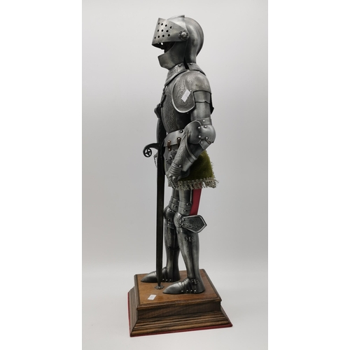 70 - A miniature model of a suit of armour and a longsword, on a square wooden plinth; together with a pl... 