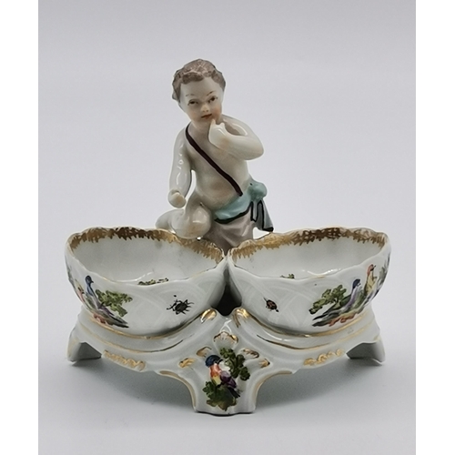 87 - A group of assorted floral porcelain, including a late 19th Century figural cruet by Helena Wolfsohn... 