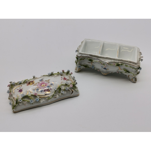 87 - A group of assorted floral porcelain, including a late 19th Century figural cruet by Helena Wolfsohn... 