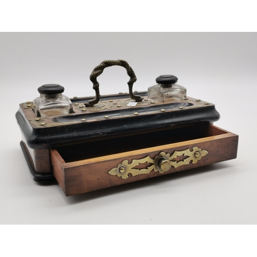 9 - A Victorian brass-mounted walnut double desk stand with twin ink bottles and pen trays, single drawe... 