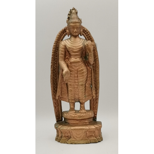 258 - A bronze Maitreya Buddha figure, standing on a plinth before an arch, painted to the front. Approx. ... 