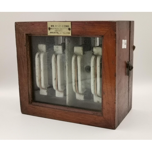 270 - A glass-fronted oak display case with vintage electrical fuses, early 20th Century, name plaque to t... 