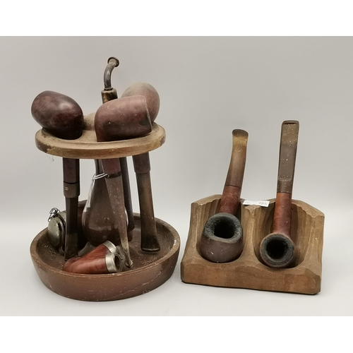 274 - A collection of various tobacco pipes, on two stands, including examples by Bewlay, Comoy (The Mansi... 