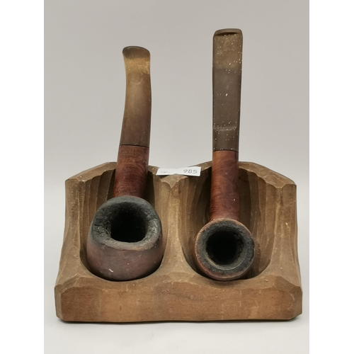 274 - A collection of various tobacco pipes, on two stands, including examples by Bewlay, Comoy (The Mansi... 