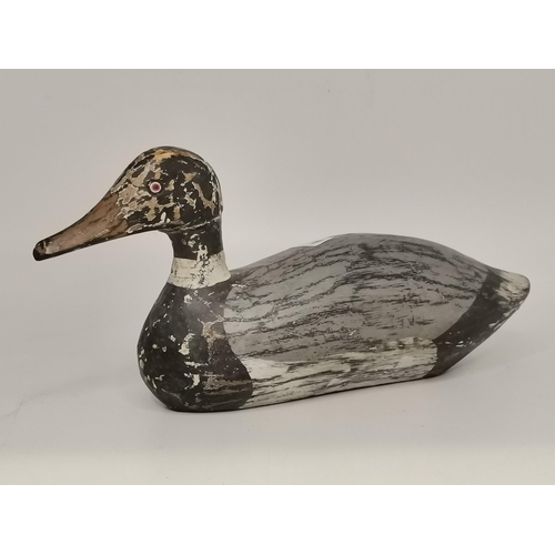 281 - Three naïve wooden decoy ducks, carved and painted. (3) Largest 39cm long