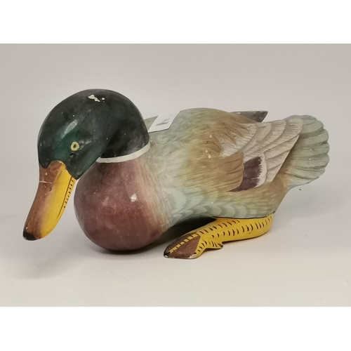 281 - Three naïve wooden decoy ducks, carved and painted. (3) Largest 39cm long