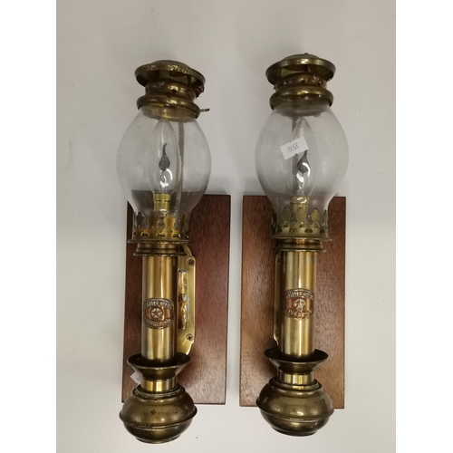 284 - A pair of early 20th Century brass cabin wall lamps, converted for electricity (wiring cut), each wi... 