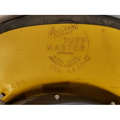 286 - A vintage yellow Protector Tuff Master hard hat with ear protection, with British Petroleum Tanker o... 