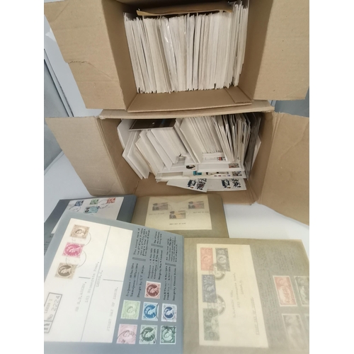 289 - Stamps: A large quantity of First Day Covers - 2 boxes of loose, and 2 albums.