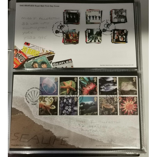 291 - Four albums of assorted First Day Covers, loose stamps, commemorative coins and coin covers, etc., v... 