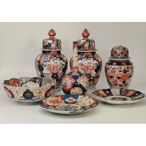 304 - A collection of assorted Imari decorated porcelain wares, including a pair of lobed baluster vases a... 