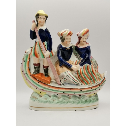 315 - A collection of Staffordshire pottery wares, including two spill vases, a figural pastille burner, f... 