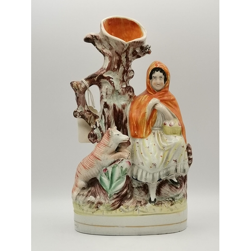 315 - A collection of Staffordshire pottery wares, including two spill vases, a figural pastille burner, f... 