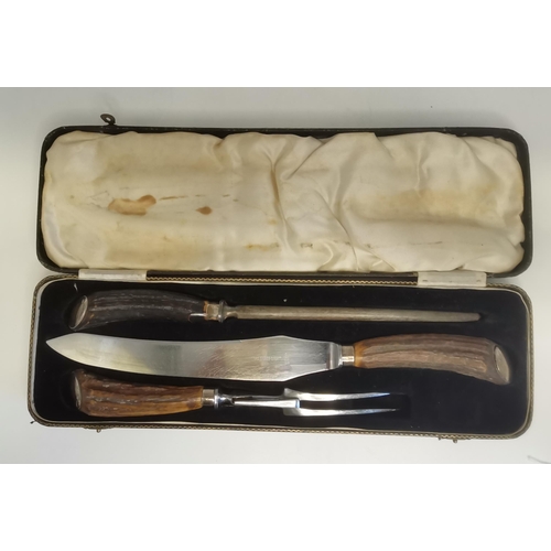 341 - A George V silver-mounted three-piece carving set by John Biggin, Sheffield 1933, the antler handles... 