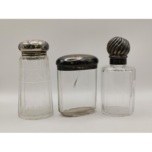 345 - A small group of silver and silver-plated wares, comprising a silver-lidded glass scent bottle (lack... 