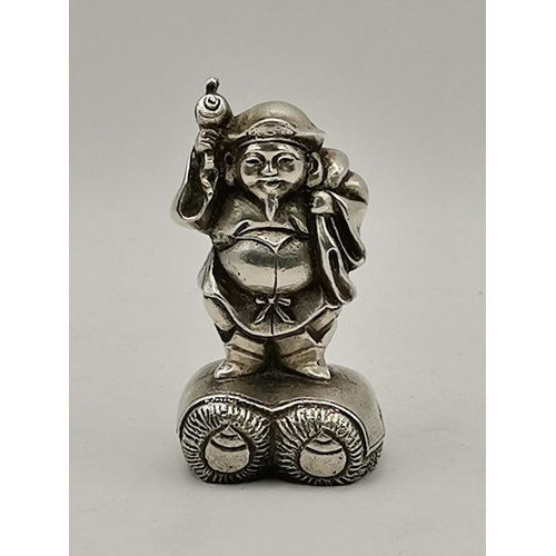 383 - A Chinese silver figural scroll weight of Daikoku (Daikokuten), stamped 'high grade' in character ma... 