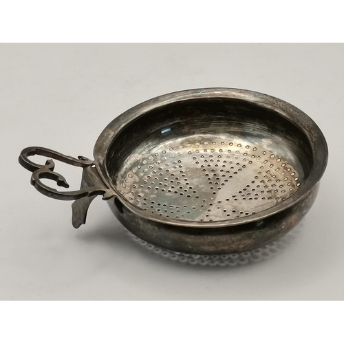 389 - A George IV Scottish silver lemon strainer by George McHattie, Edinburgh 1821, the bowl pierced with... 