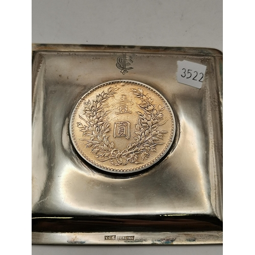 401 - An early 20th Century Chinese sterling silver coin pin dish, square with bamboo moulded edge and sti... 