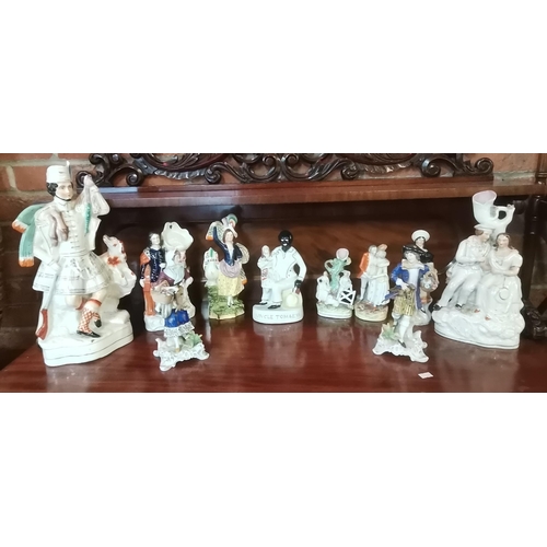 409 - A collection of Staffordshire figurines including 19th century 'Uncle Tom & Eva'