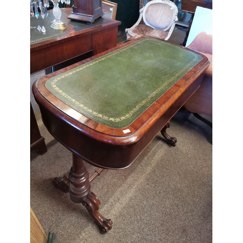 726 - A mahogany fold-over games table, the rounded rectangular top with inset gilt-tooled green leather w... 