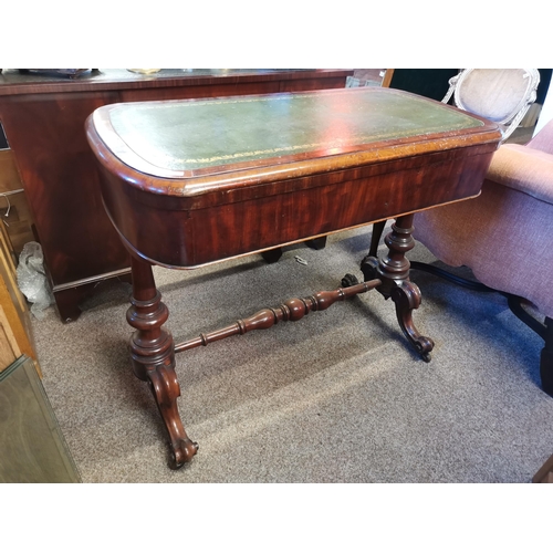 726 - A mahogany fold-over games table, the rounded rectangular top with inset gilt-tooled green leather w... 