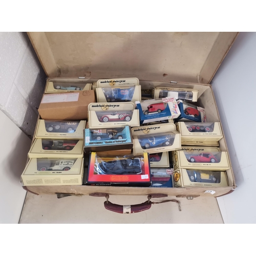 733 - Vintage suitcase with over 60 boxed 