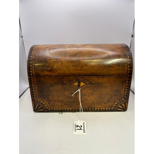 21 - A Victorian burr walnut tea caddy, dome-topped, with inlaid decoration, two internal compartments wi... 