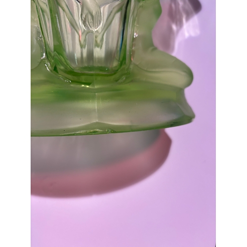 333 - An Art Deco figural uranium glass vase, with two females kneeling facing outwards, their hands joine... 