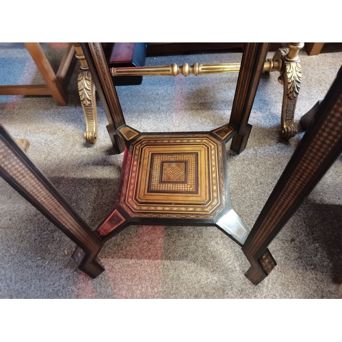 722 - A Moorish marquetry side table, square with ornate hardwood and ivory inlay, on stepped square legs ... 