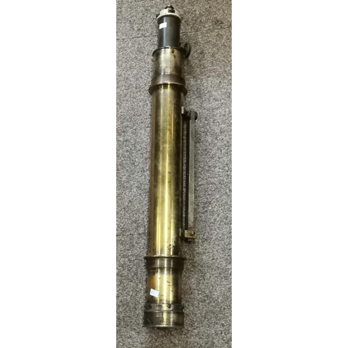 67 - A large brass telescope, unmarked, with fixing slide and end cap. 76cm long
