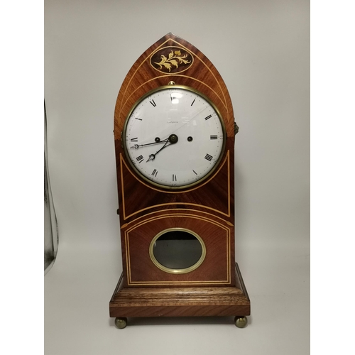 25 - Regency Mahogany Beehive mantel clock with satinwood inlay sat on brass bezel feet and brass lionhea... 