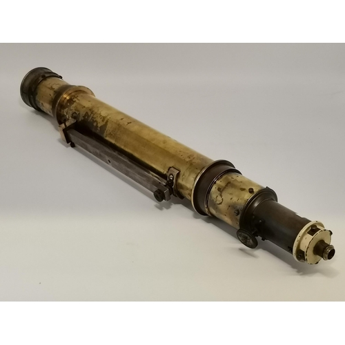 28 - A large brass telescope, unmarked, with fixing slide and end cap. 76cm long