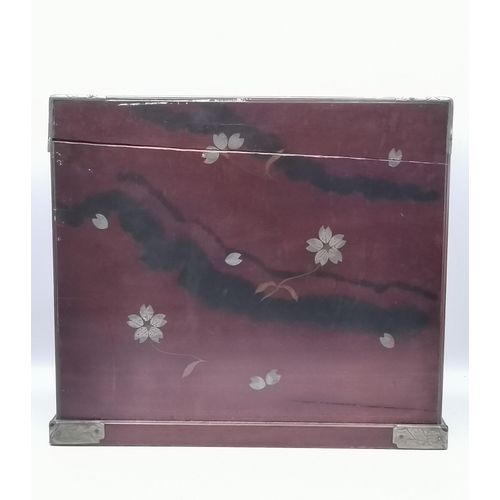 38 - An Oriental lacquered tabletop cabinet, a pair of doors over a deep drawer, five small drawers to th... 