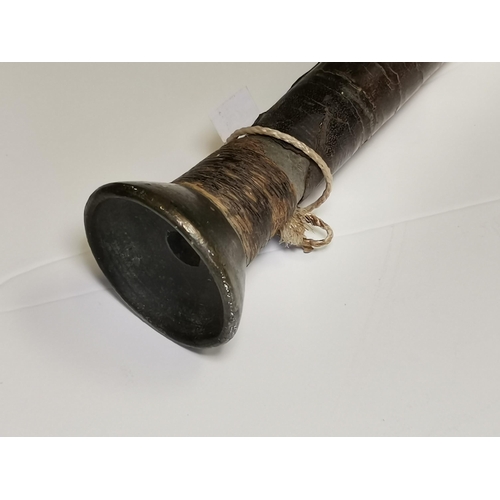 54 - An antique veterinary bovine instrument, the leather-covered tube with pierced brass ovoid fitting a... 