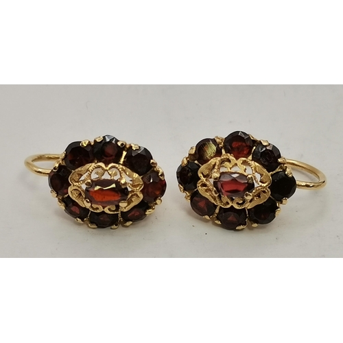 432A - Three pairs of gem-stone earrings, comprising a pair of 9 carat gold emerald and diamond cluster stu... 