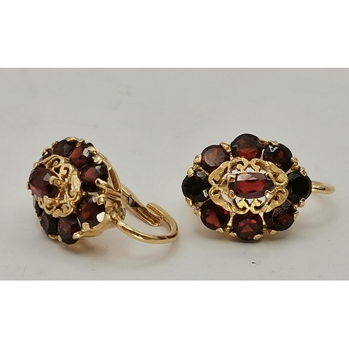 432A - Three pairs of gem-stone earrings, comprising a pair of 9 carat gold emerald and diamond cluster stu... 