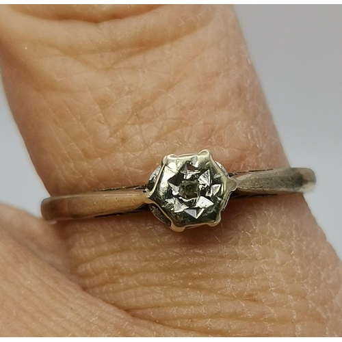 433A - An 18 carat gold and platinum white stone cluster ring, the seven round stones set as a flowerhead, ... 