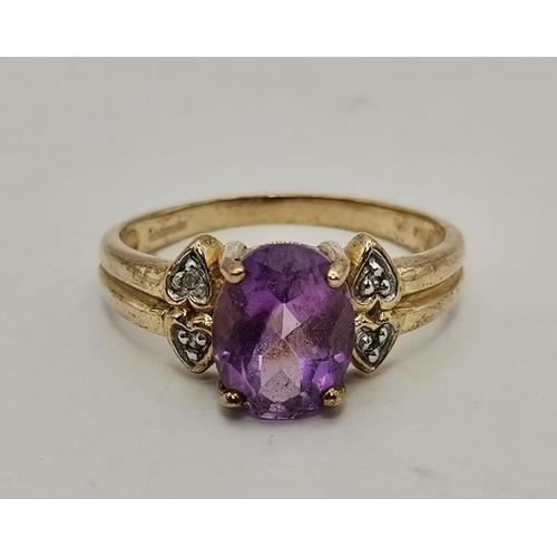 434A - Three 9 carat gold purple stone rings, the first claw-set with a cloudy oval stone to trifurcated op... 
